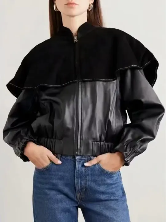 A black leather and suede jacket photographed on a model